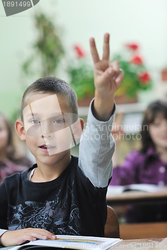 Image of happy young boy at first grade math classes 