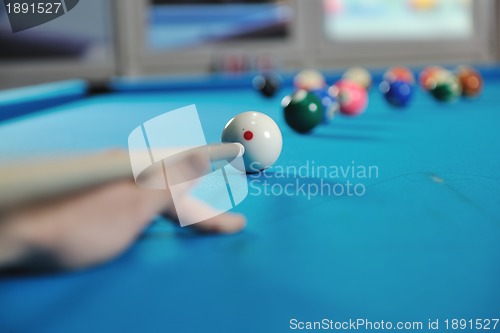 Image of young man play pro billiard game 