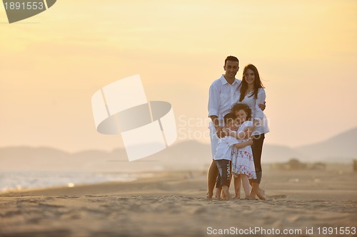 Image of happy young family have fun on beach