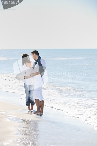 Image of happy young couple have fun at beautiful beach