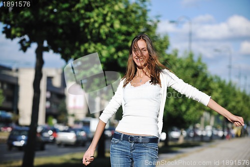 Image of young woman havefun at street 