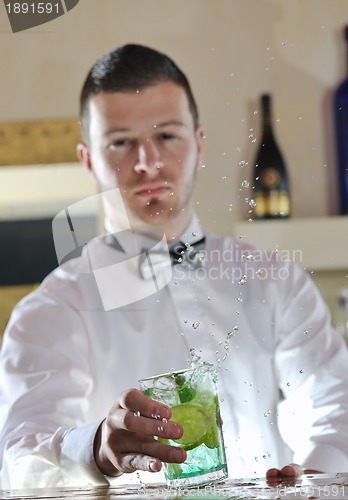 Image of pro barman prepare coctail drink on party