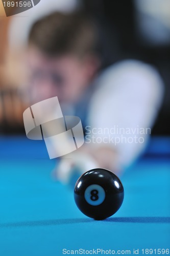 Image of young man play pro billiard game 