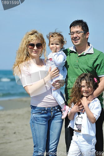 Image of happy young family have fun on beach