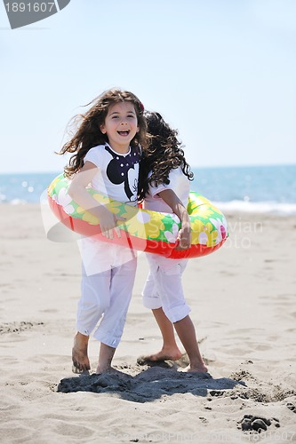 Image of happy young  people group have fun on beach