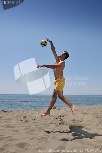 Image of male beach volleyball game player