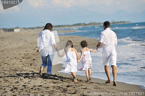 Image of happy young  family have fun on beach