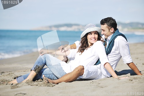 Image of happy young couple have fun at beautiful beach