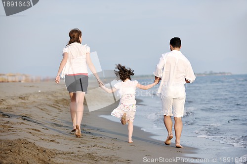 Image of happy young family have fun on beach