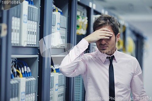 Image of young it engeneer in datacenter server room