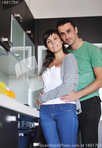 Image of young couple have fun in modern kitchen