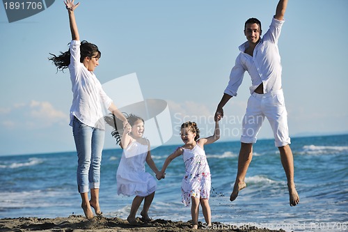 Image of happy young  family have fun on beach