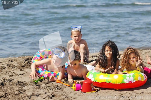 Image of child group have fun and play with beach toys