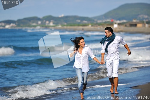 Image of happy young couple have fun at beautiful beach