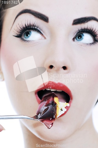 Image of beautiful young woman eat sweet cake