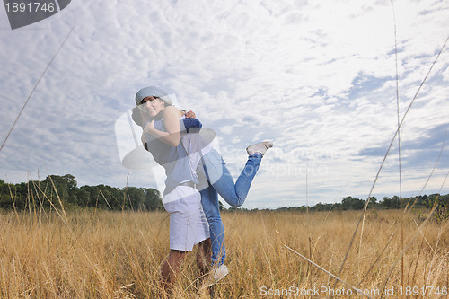 Image of happy young couple have romantic time outdoor