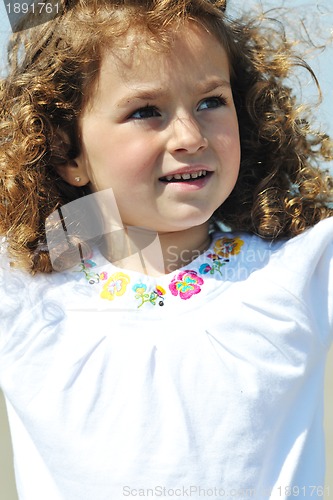 Image of little female  child portrait on the beach
