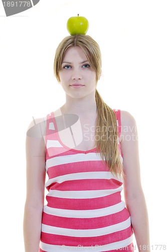 Image of happy  young  woman eat green apple isolated  on white