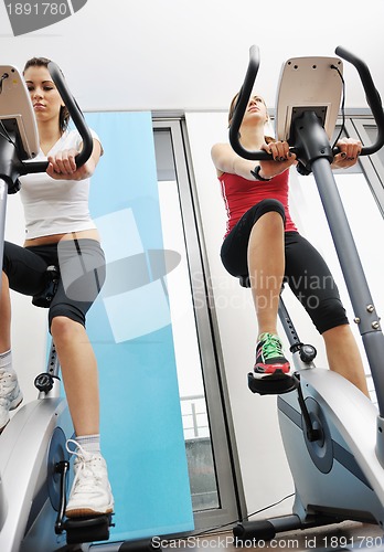 Image of womanworkout  in fitness club on running track machine 