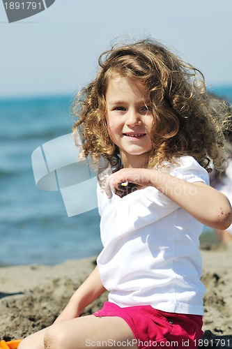 Image of little female  child portrait on the beach