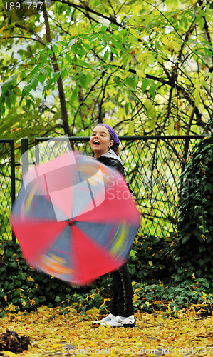 Image of happy girl with umbrella