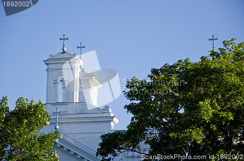 Image of Church towers and cross on  blue sky 