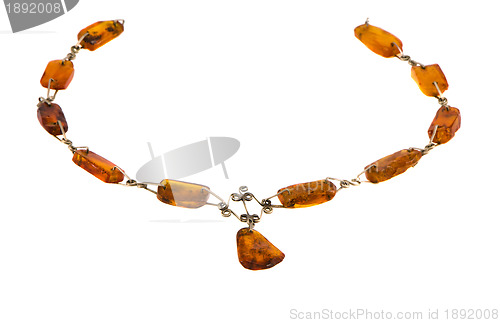 Image of Amber gold color stone necklace isolated on white 