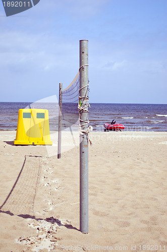 Image of Volleyball net sea sand waste bin lifeguard boat 