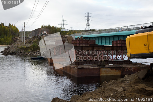 Image of Construction of the bridge using a craft