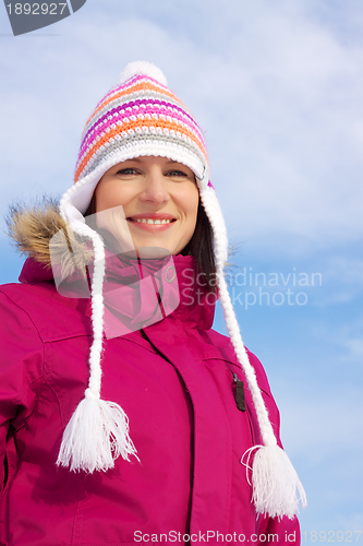 Image of Smiling girl in winter clothes