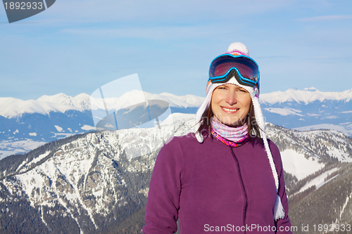 Image of Smiling girl with winter panorama