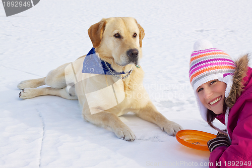 Image of Girl with her dog in winter