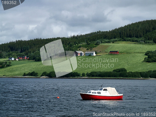 Image of Lonely boat and green coast