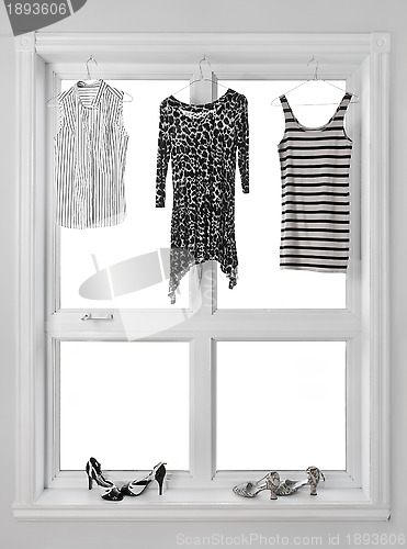 Image of Clothes hanging in the window