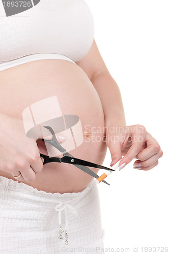 Image of Pregnant belly with cigarettes