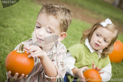 Image of Cute Young Brother and Sister At the Pumpkin Patch