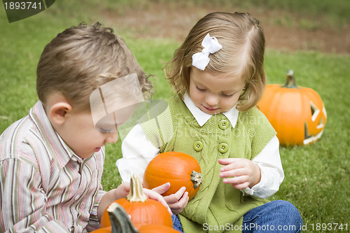 Image of Cute Young Brother and Sister At the Pumpkin Patch