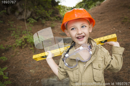 Image of Adorable Child Boy with Level Playing Handyman Outside
