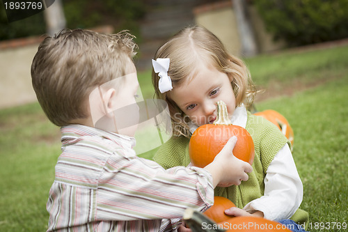 Image of Cute Young Brother and Sister At the Pumpkin Patch