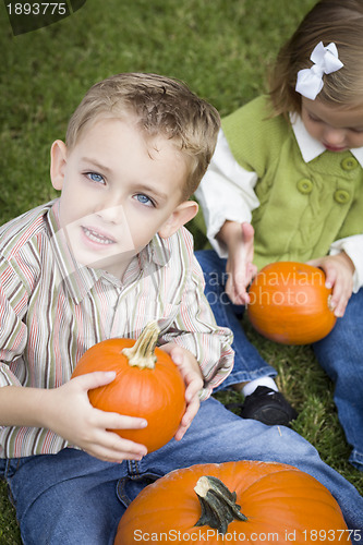 Image of Cute Young Brother and Sister At the Pumpkin Patch