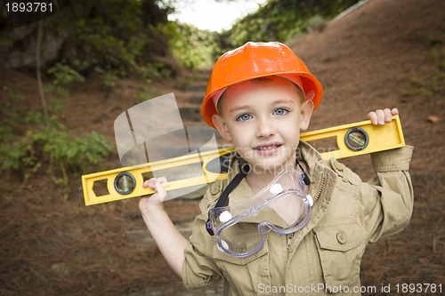 Image of Adorable Child Boy with Level Playing Handyman Outside