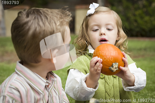 Image of Cute Young Brother and Sister At the Pumpkin Patch