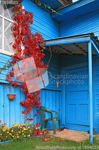 Image of red sheet on wall of the rural building