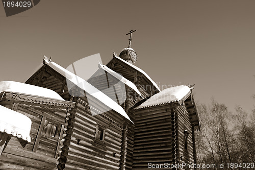 Image of wooden chapel on celestial background, sepia