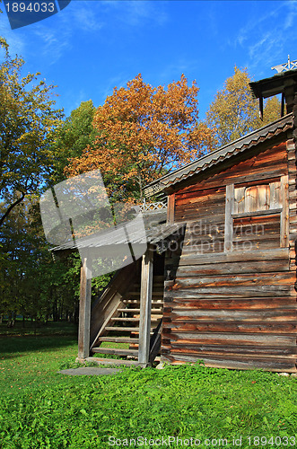 Image of rural wooden house amongst autumn wood