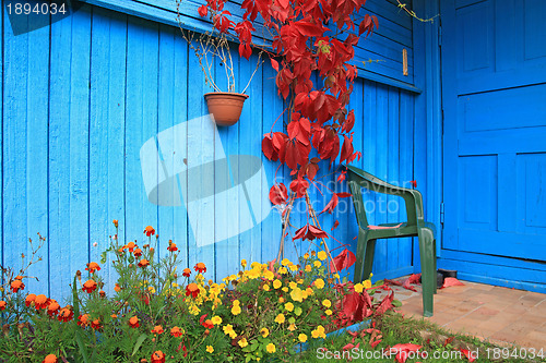 Image of red sheet on wall of the rural building