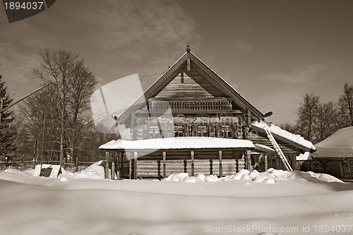 Image of old wooden house in village , sepia