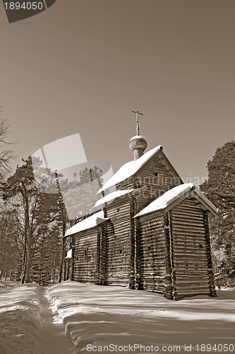 Image of wooden chapel in pine wood, sepia