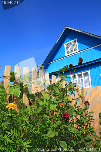 Image of blue rural house on celestial background 