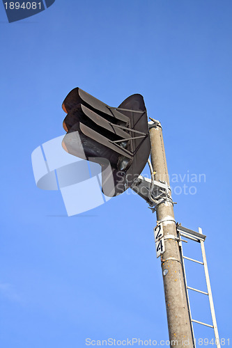 Image of railway semaphore on blue background